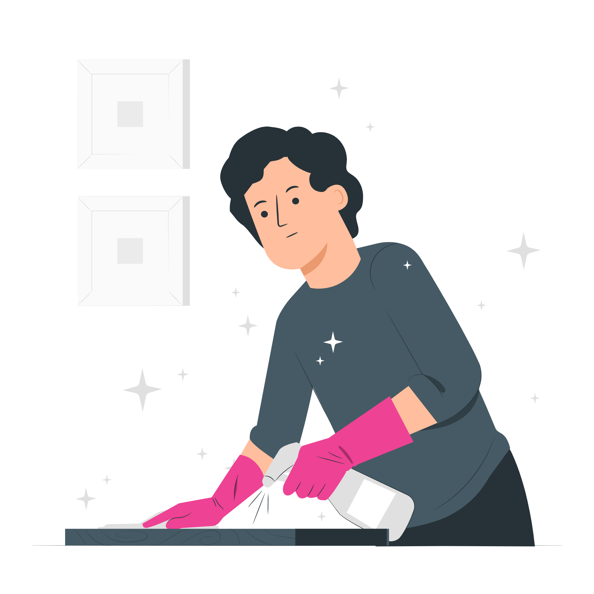 A person in pink gloves cleaning a counter top